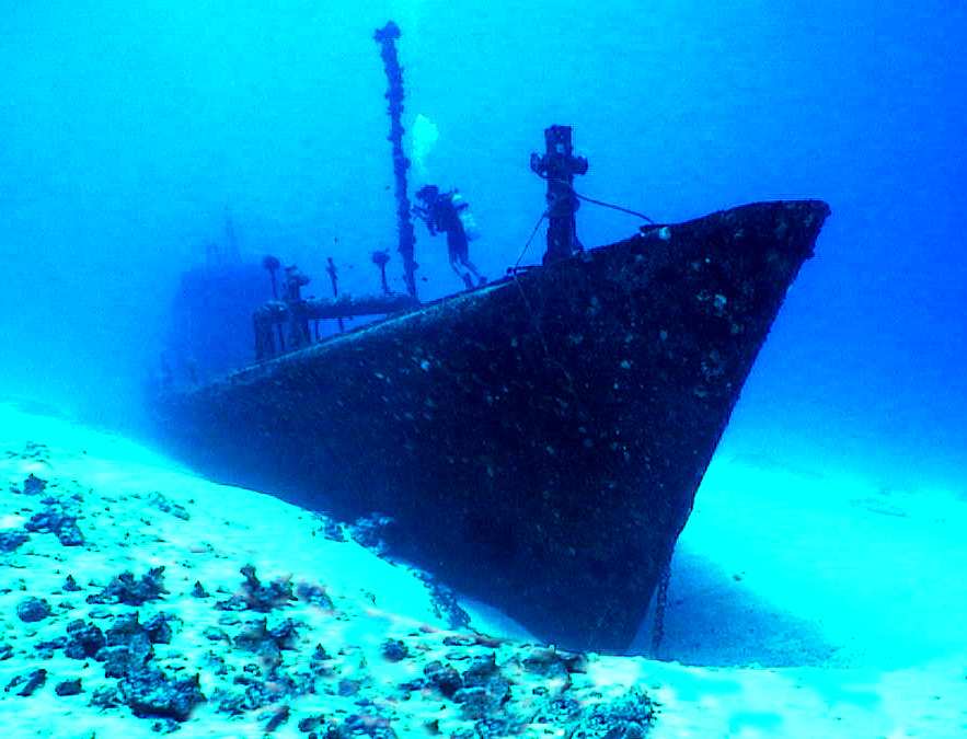 Photo: 7-Screws Shipwreck sitting on a sandy bottom